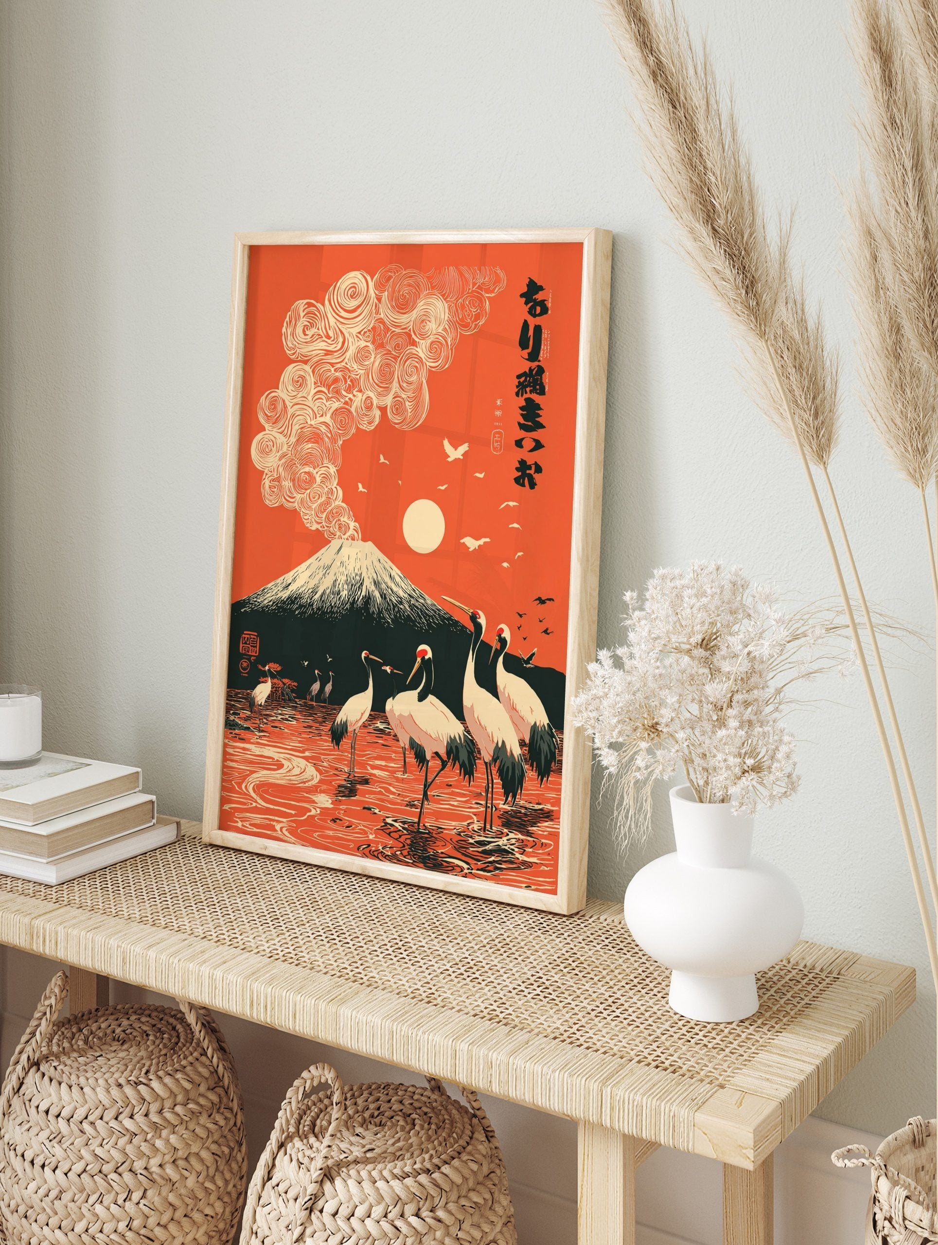Mount Fuji with swirling clouds and red-crowned cranes in orange Japanese landscape art print, in an alternate framed mockup