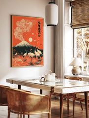 Mount Fuji with swirling clouds and red-crowned cranes in orange Japanese landscape art print, in a styled room mockup