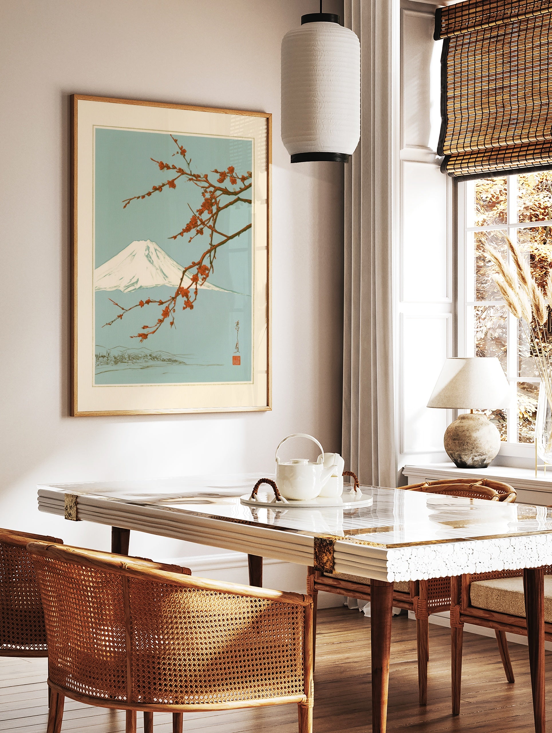Japanese art print featuring a snow-capped Mount Fuji behind a branch of vibrant red plum blossoms, in a styled room mockup