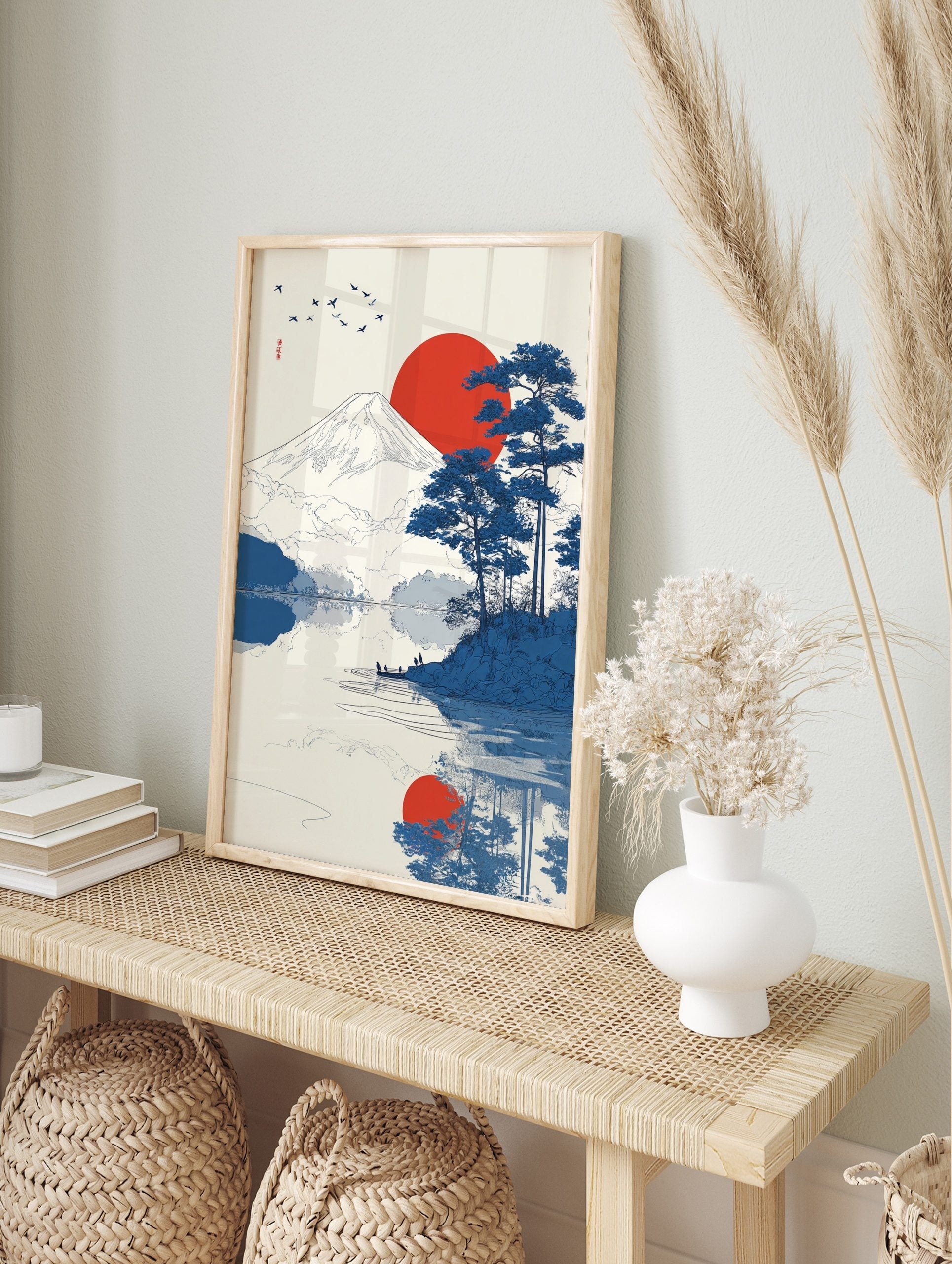 Japanese landscape art print showing Mount Fuji, a red sun, blue pine trees, birds, and, in an alternate framed mockup