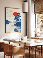 Japanese landscape art print showing Mount Fuji, a red sun, blue pine trees, birds, and reflections, in a styled room mockup