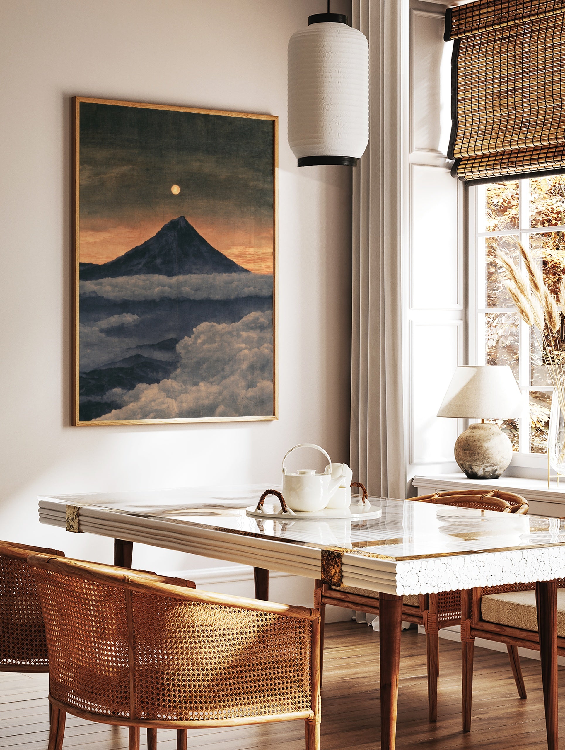 Mountain peak rising above clouds under a full moon in a twilight landscape art print, in a styled room mockup