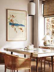 Japanese-style wall art print of Mount Fuji with red cherry blossom branches on a cream background, in a styled room mockup
