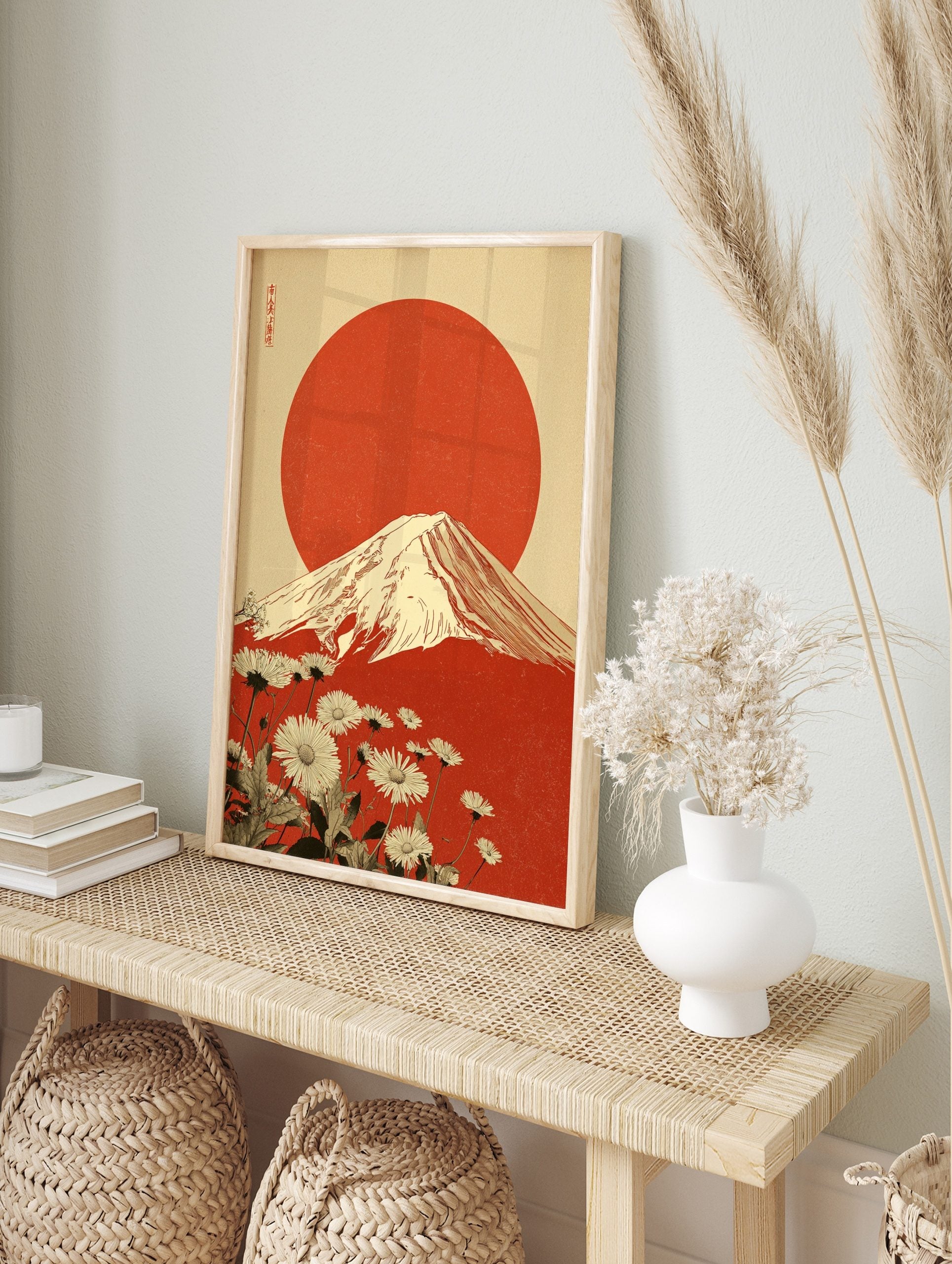 Japanese Mount Fuji art print with large red sun, white daisy flowers, and kanji text on, in an alternate framed mockup