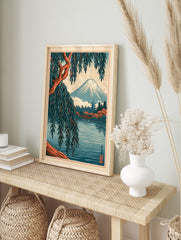 Japanese Mount Fuji landscape art print with a foreground willow tree, red bridge, and pagoda, in an alternate framed mockup