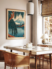 Japanese Mount Fuji landscape art print with a foreground willow tree, red bridge, and pagoda in a, in a styled room mockup