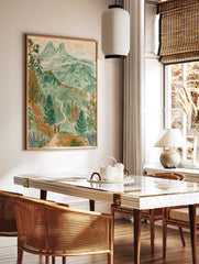 Illustrative mountain landscape wall art print featuring two hikers on a trail with pine trees and, in a styled room mockup