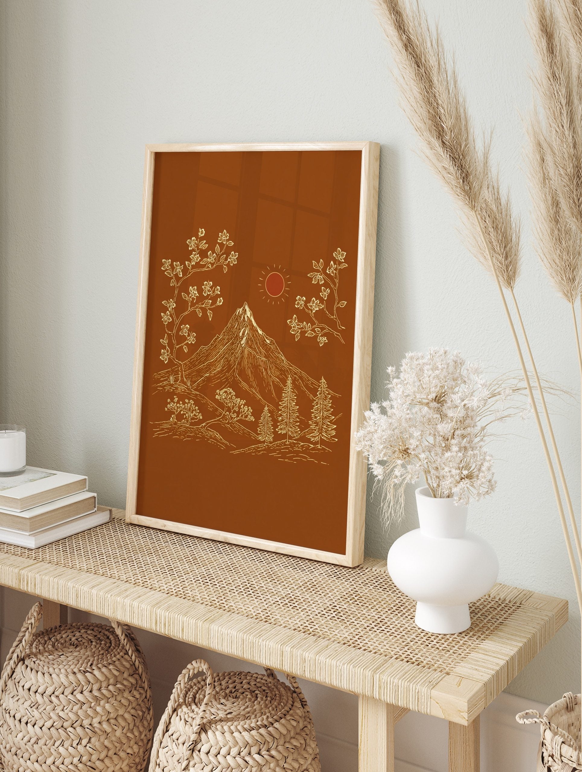 Illustrative mountain landscape art print with snow-capped peak, flowering trees, pine trees, in an alternate framed mockup