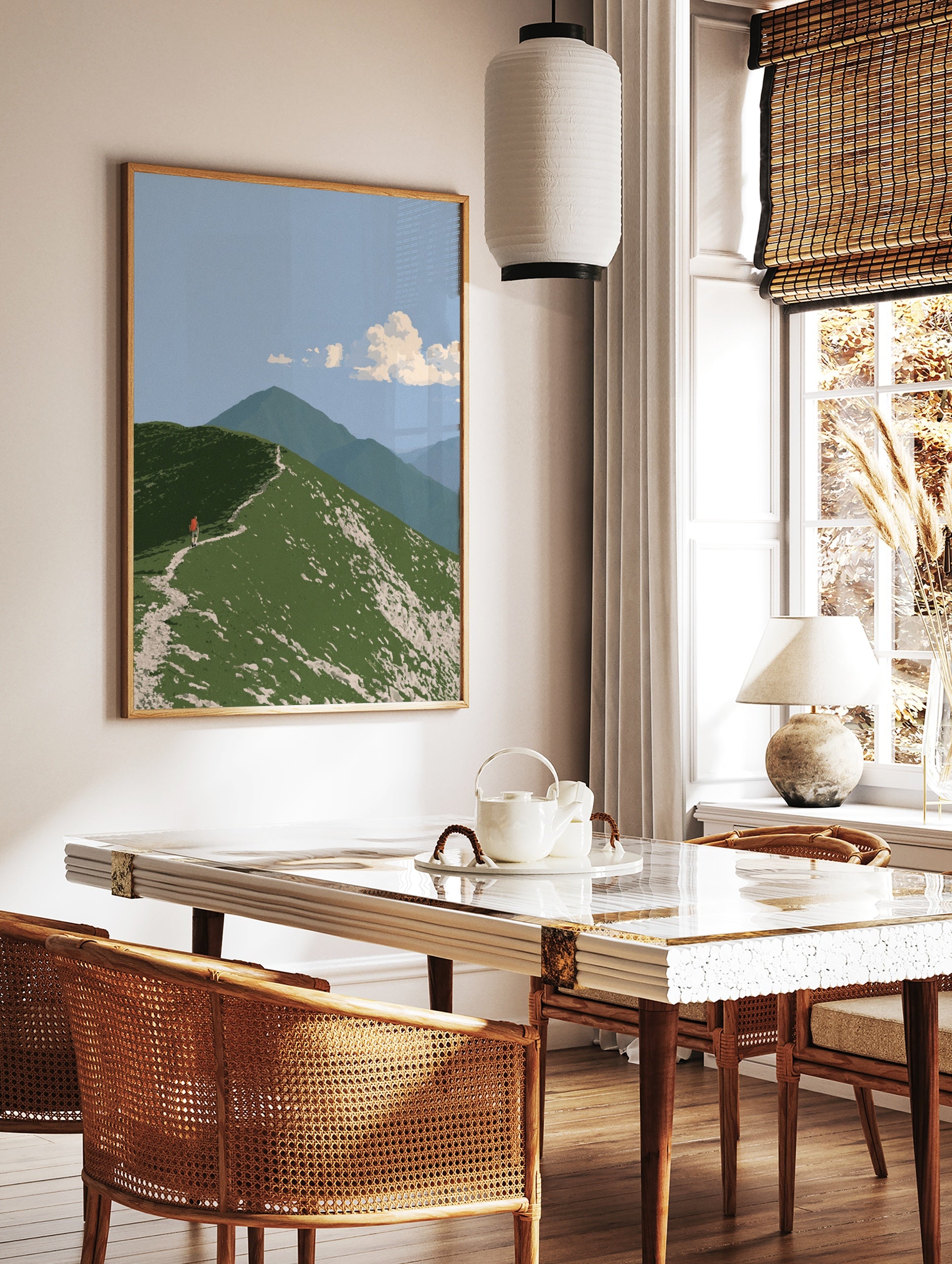 Illustrative mountain ridge wall art with a hiker wearing a red backpack on a green grassy path, in a styled room mockup