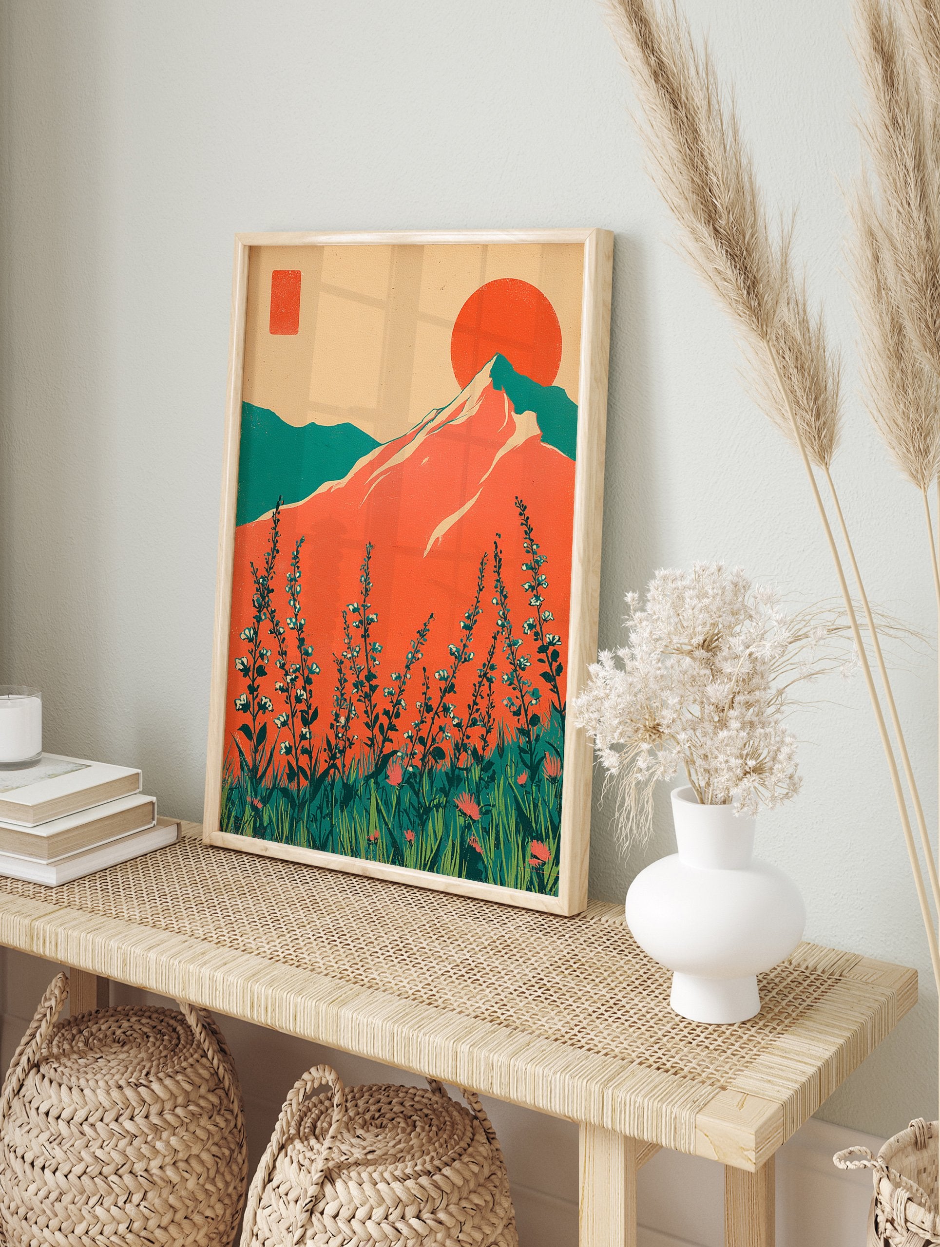 Retro mountain wall art with a large orange sun, teal mountains, and foreground wildflowers in a vibrant landscape. - Image 3