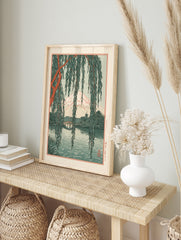 Japanese landscape art print featuring Mt. Fuji, a pagoda, and a bridge framed by hanging, in an alternate framed mockup