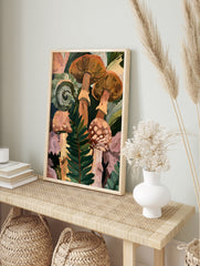 Botanical art print of forest mushrooms and a curled fern frond in shades of orange, green, in an alternate framed mockup