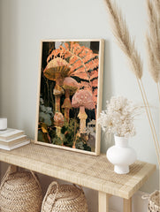 Botanical art print of forest mushrooms and fern fronds in warm orange and terracotta colours, in an alternate framed mockup