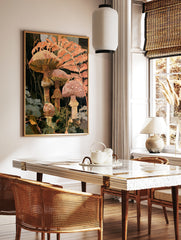 Botanical art print of forest mushrooms and fern fronds in warm orange and terracotta colours on a, in a styled room mockup