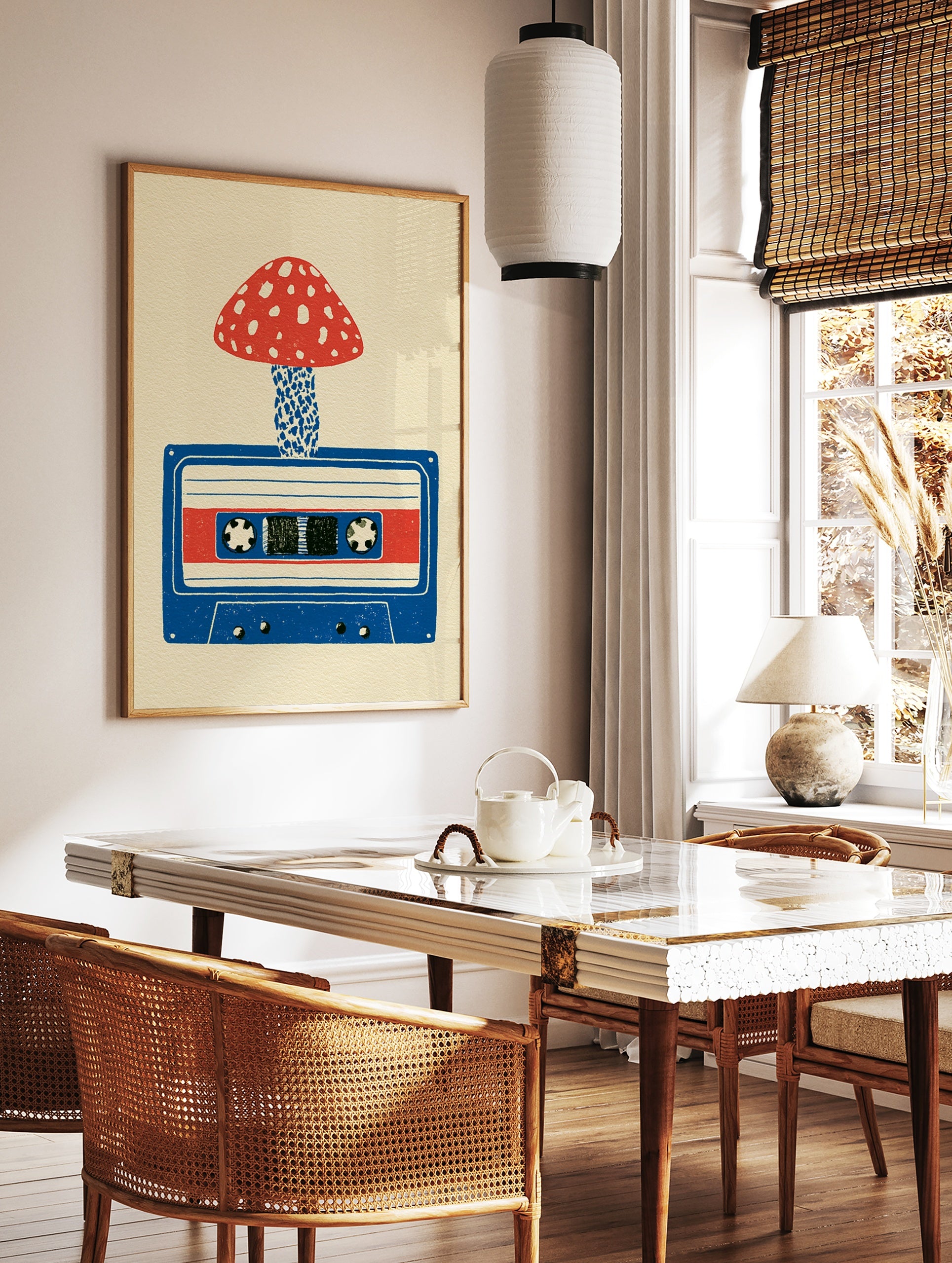 Illustrative art print of a red spotted mushroom growing from a blue cassette tape on a cream, in a styled room mockup
