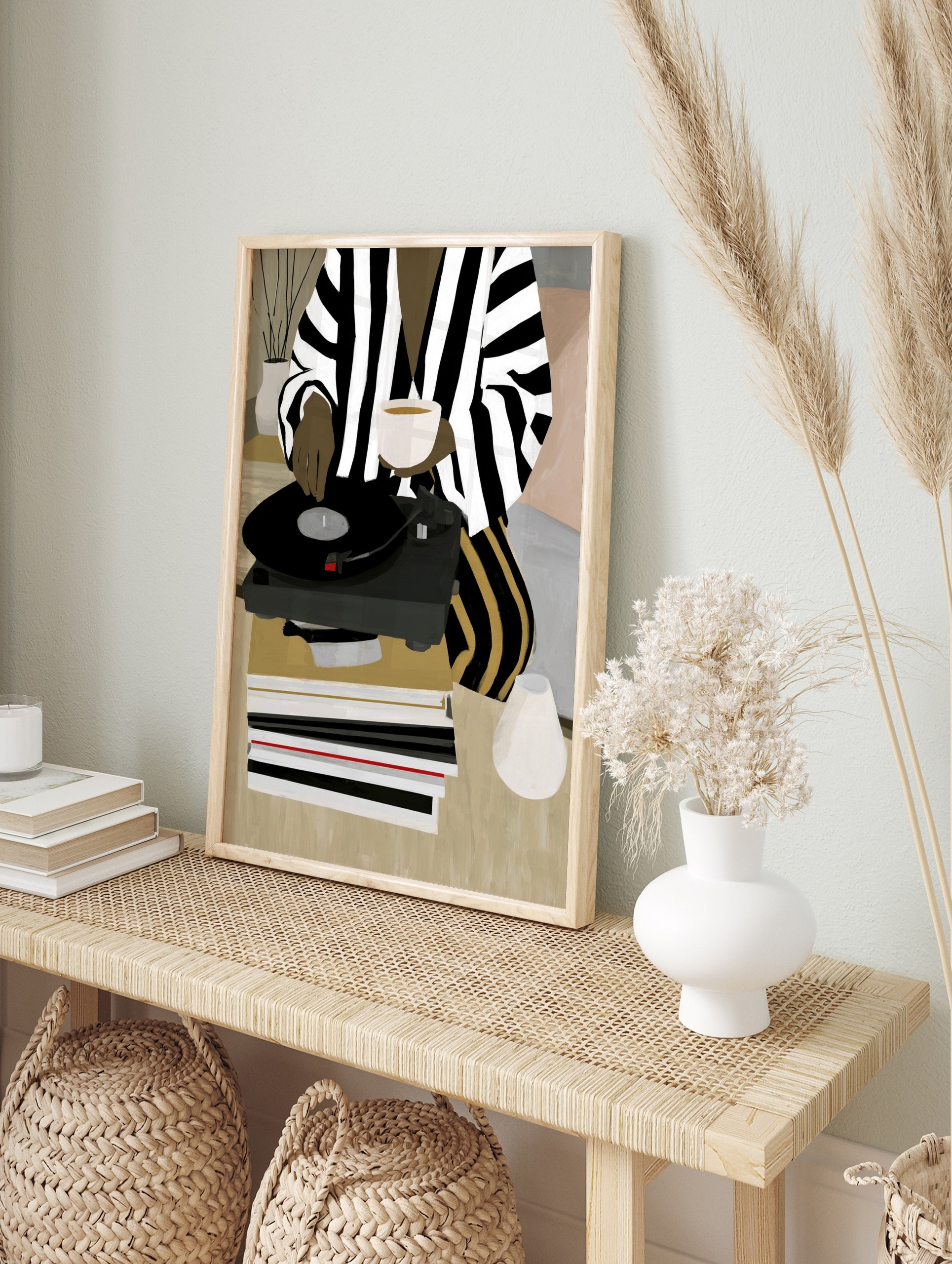 Illustration of a person in striped clothing using a vinyl record player with a cup and, in an alternate framed mockup