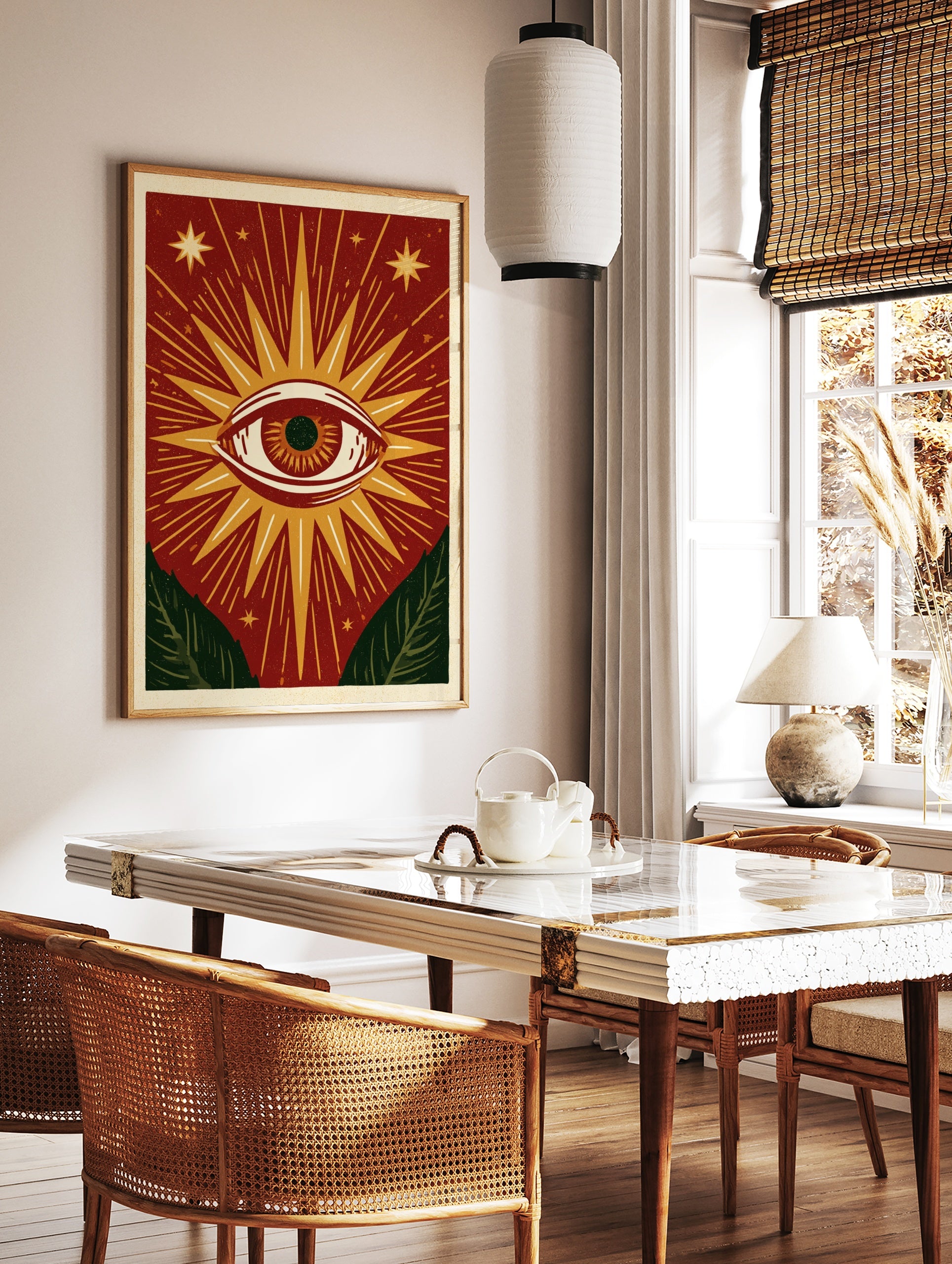 Mystical eye illustration with sunburst rays, stars, and green leaves on a red background, unframed, in a styled room mockup