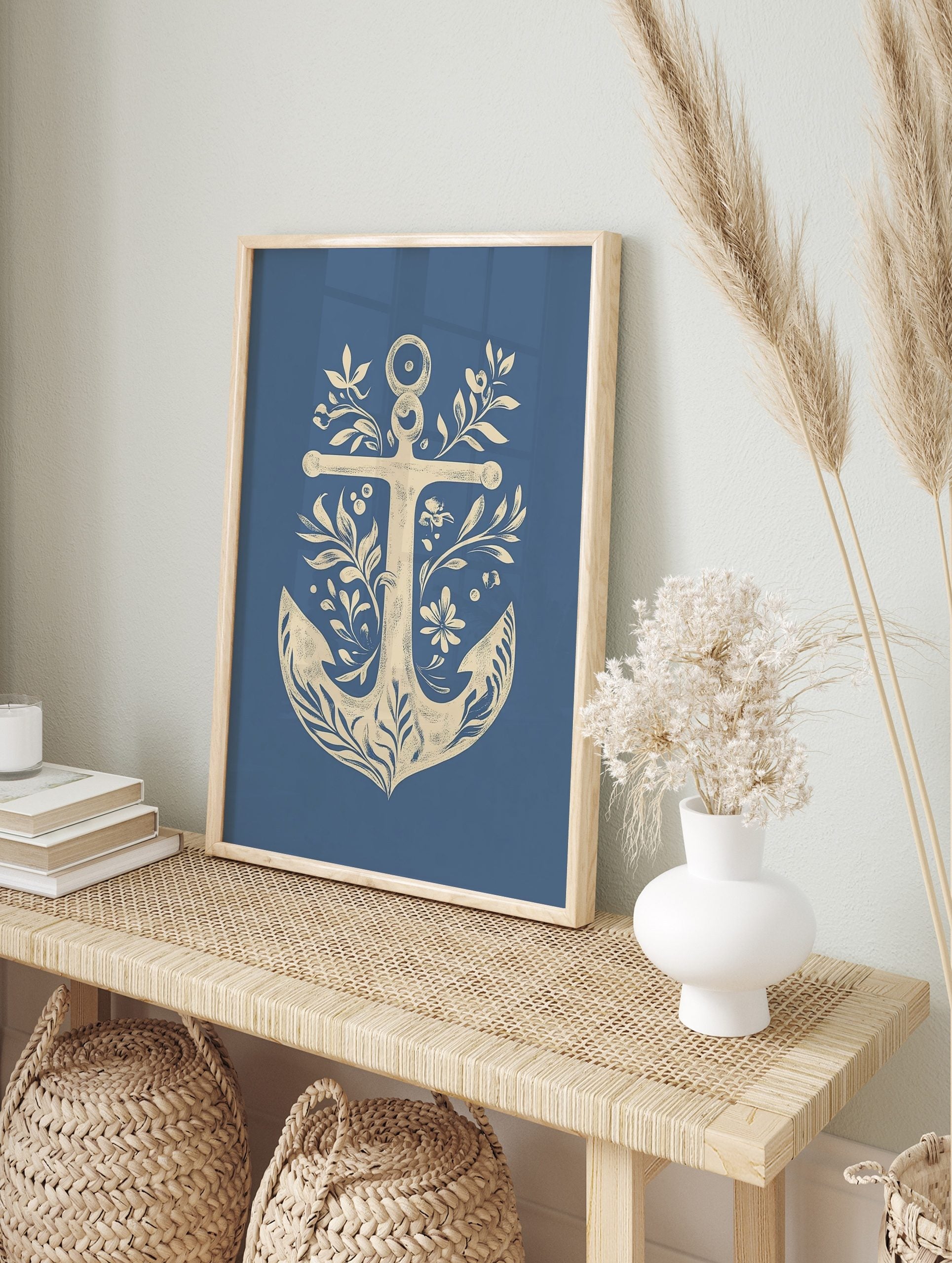 Decorative nautical anchor illustration art print with botanical leaves, flowers, and berries, in an alternate framed mockup