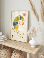 Illustrative nautilus shell art print with patterned segments, starfish, and spiral motifs on, in an alternate framed mockup