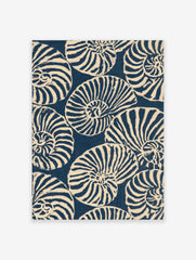 Repeating pattern of navy blue and off-white nautilus seashells in an illustrative graphic style