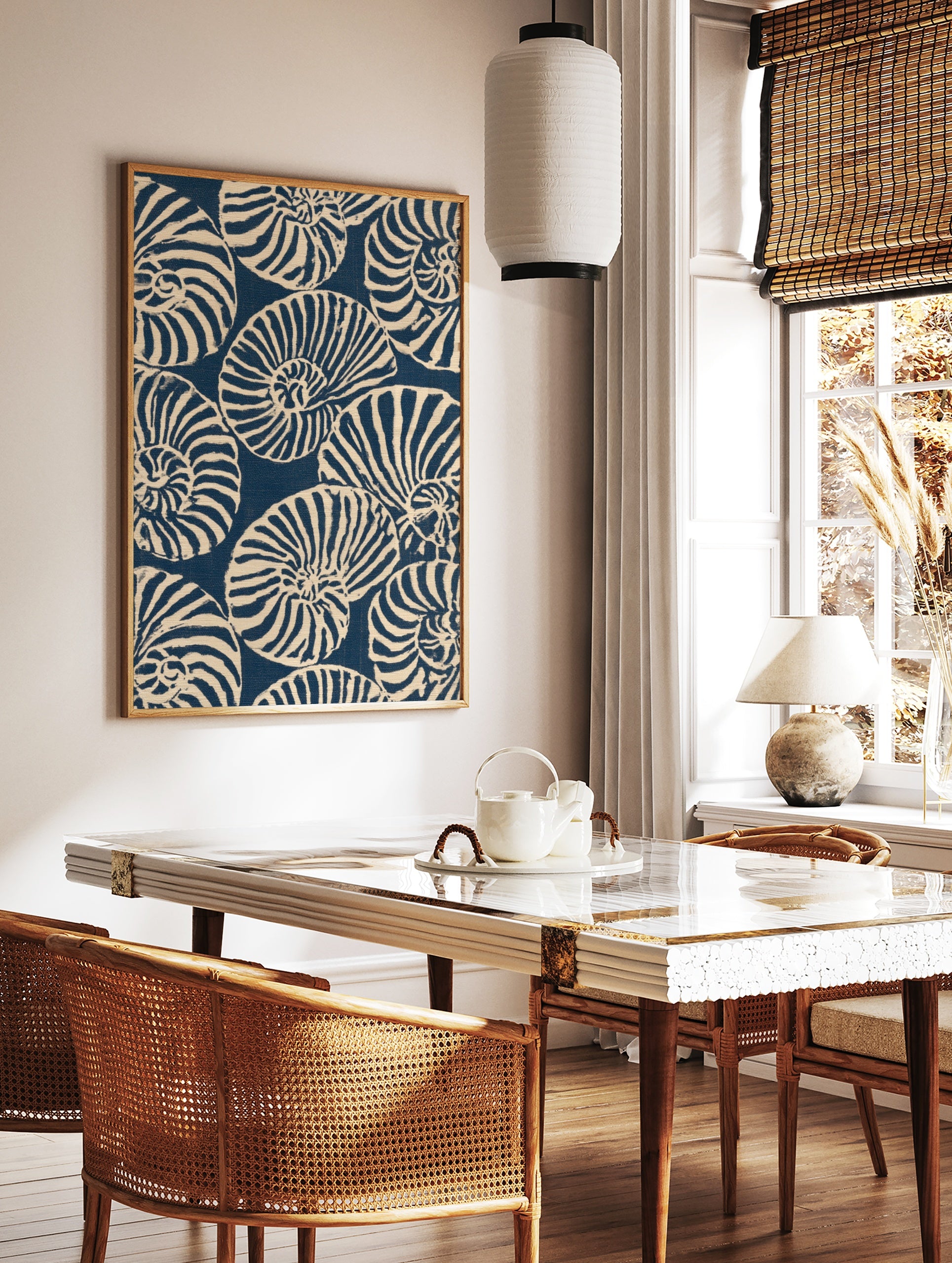 Repeating pattern of navy blue and off-white nautilus seashells in an illustrative graphic style, in a styled room mockup