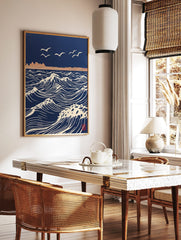Stylised navy blue ocean waves with white crests and flying seagulls, distant land, in woodblock, in a styled room mockup