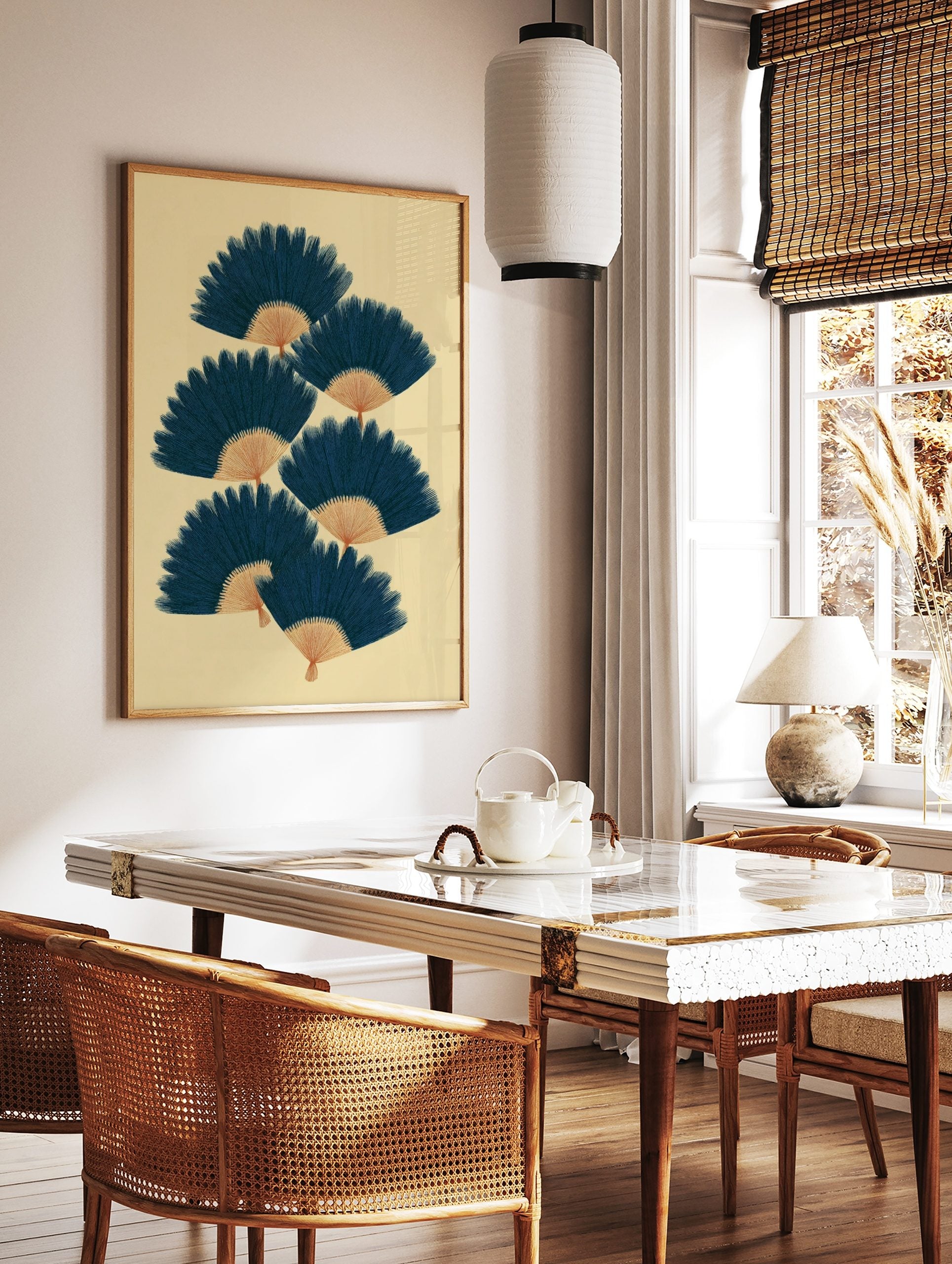 Illustrative navy blue fan shapes with tan bases, arranged in a staggered pattern on a beige, in a styled room mockup