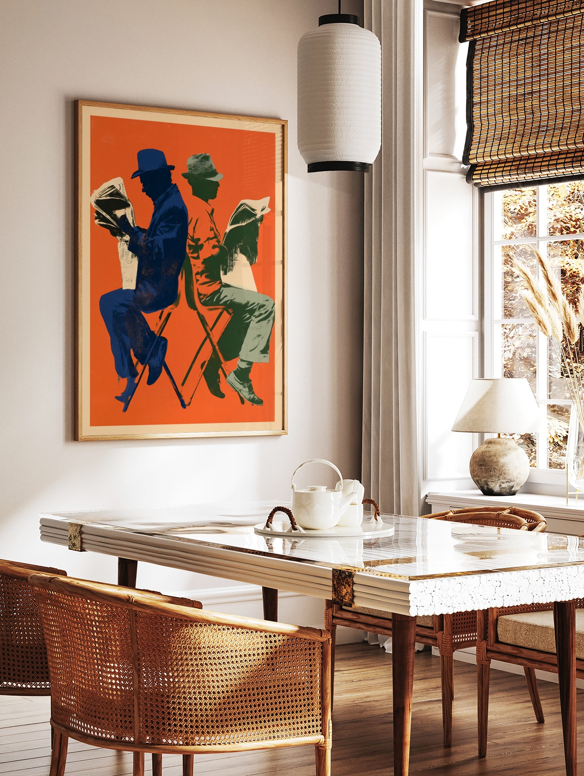 Retro illustrative art print of two figures reading newspapers against a vibrant orange background, in a styled room mockup