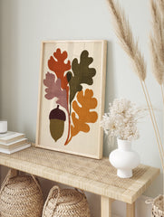 Stylised oak leaves and acorn botanical illustration with rust, olive, and mustard colours on, in an alternate framed mockup