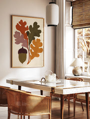 Stylised oak leaves and acorn botanical illustration with rust, olive, and mustard colours on a, in a styled room mockup
