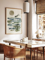 Abstract ocean diver swimming over blue-green water with a large beige sun and underwater plants, in a styled room mockup