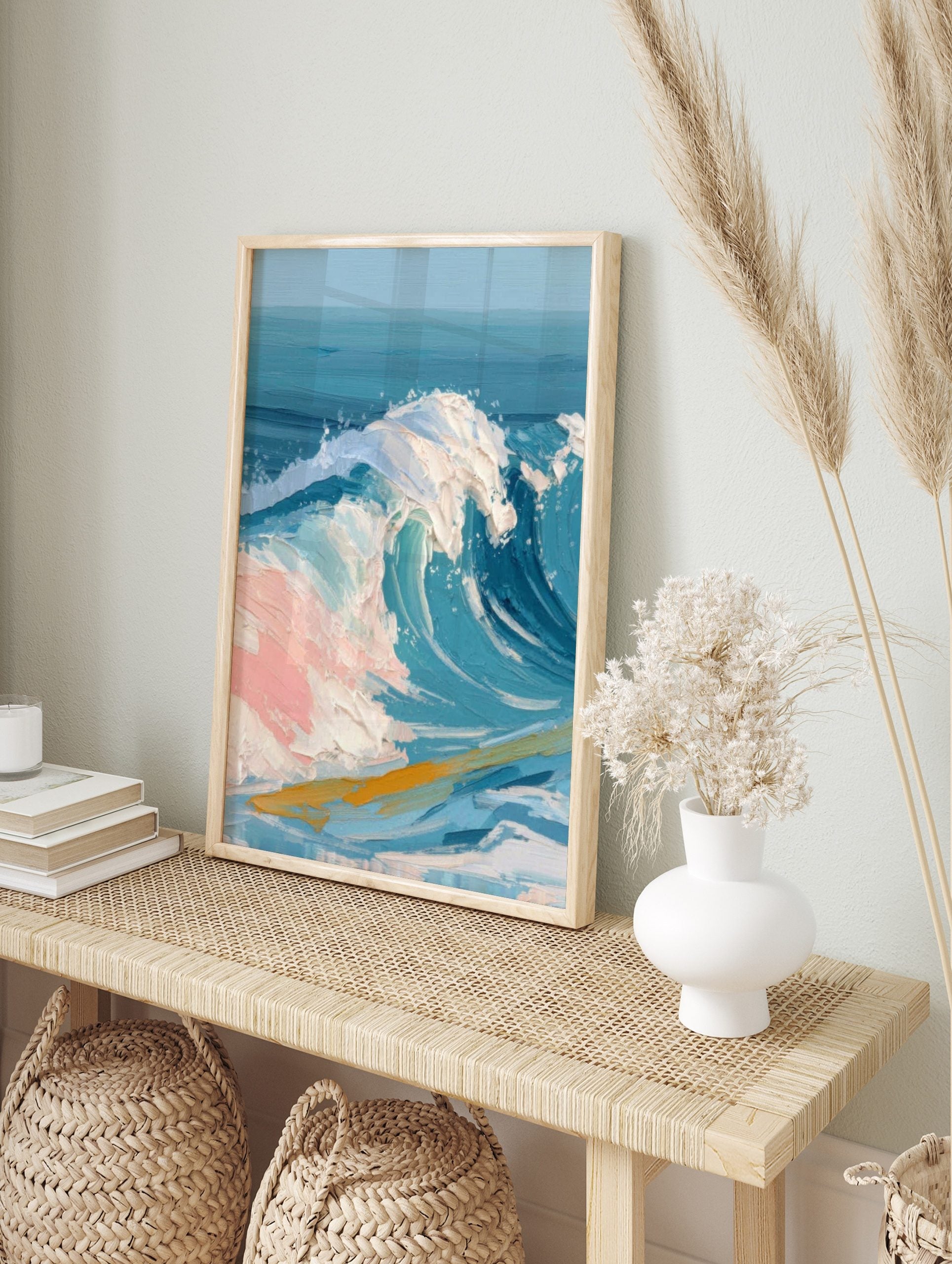 Textured painting of a large blue ocean wave with white foam and pink highlights, golden, in an alternate framed mockup
