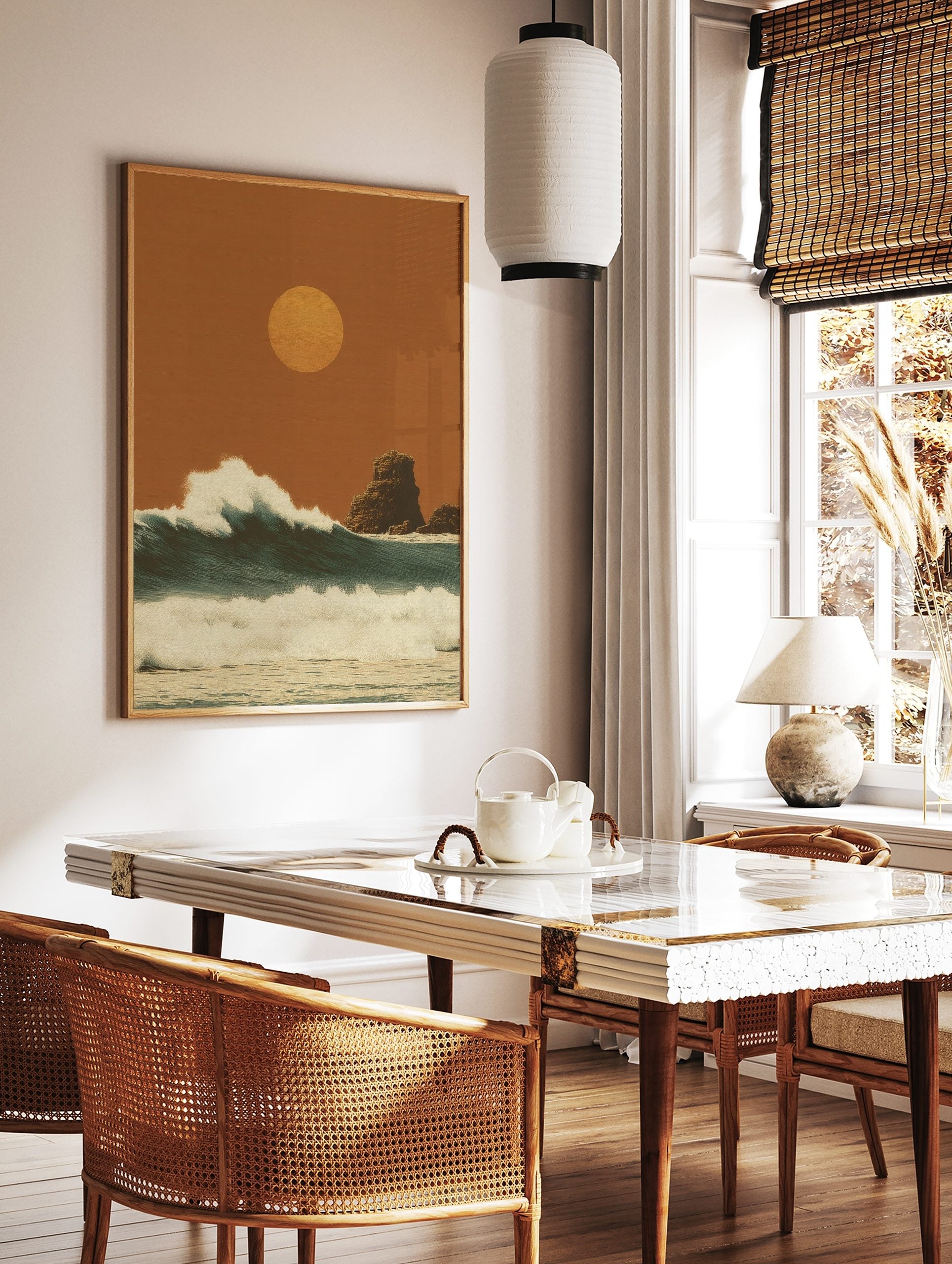Stylised ocean waves under a warm orange sun with rock formations in a textured, illustrative art, in a styled room mockup