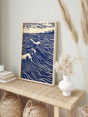 Illustrative blue ocean waves with white crests, a distant tree-lined coast, and striped sky, in an alternate framed mockup