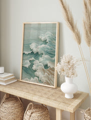 Illustrative ocean waves art print with white foam crests and teal water, in a Japanese style, in an alternate framed mockup