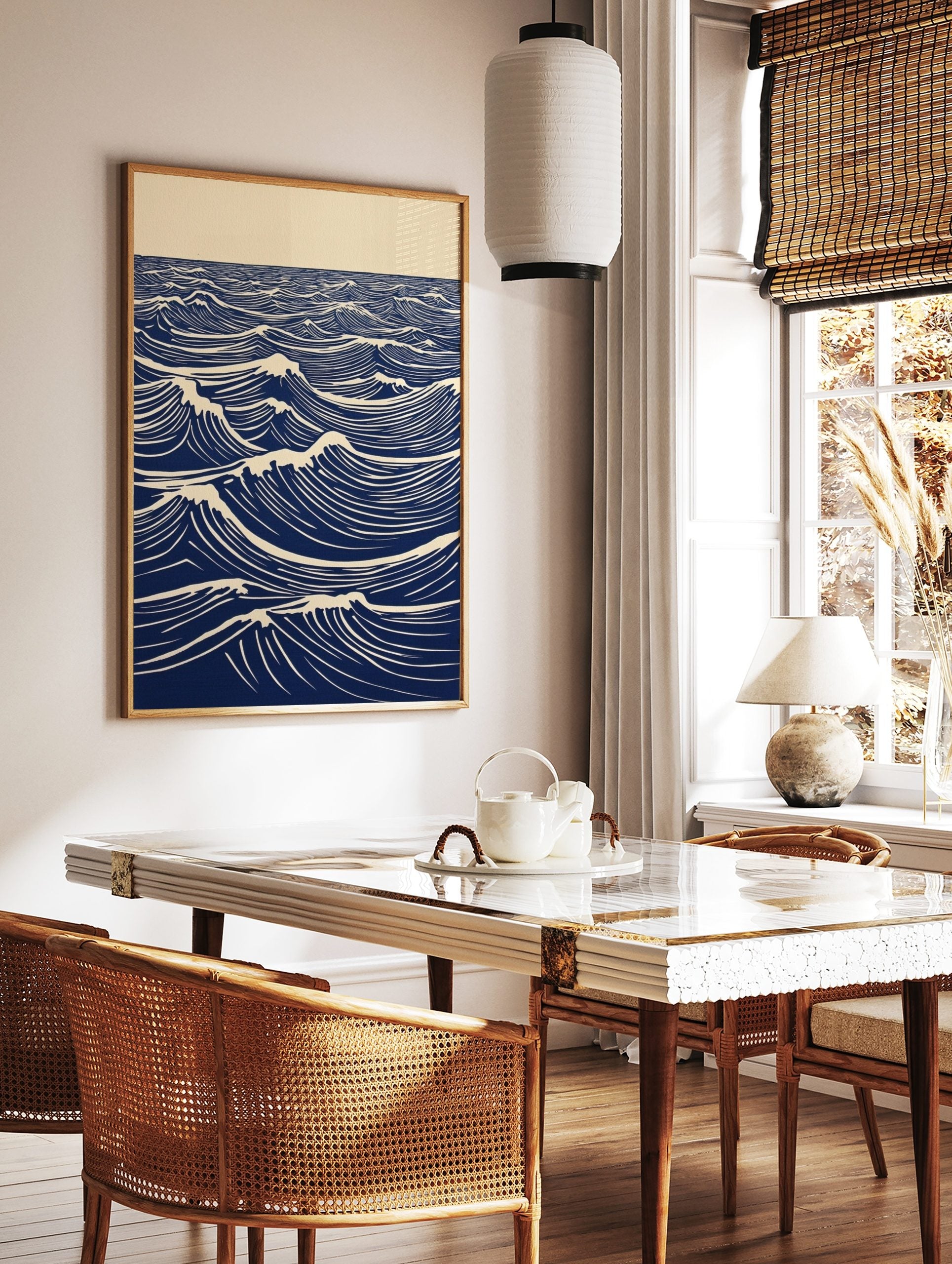 Stylised blue and white lino print of ocean waves with foam crests extending to the horizon, in a styled room mockup
