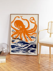 Orange octopus wall art print with dark blue ocean waves on a cream background, illustrated in a linocut style. - Image 2