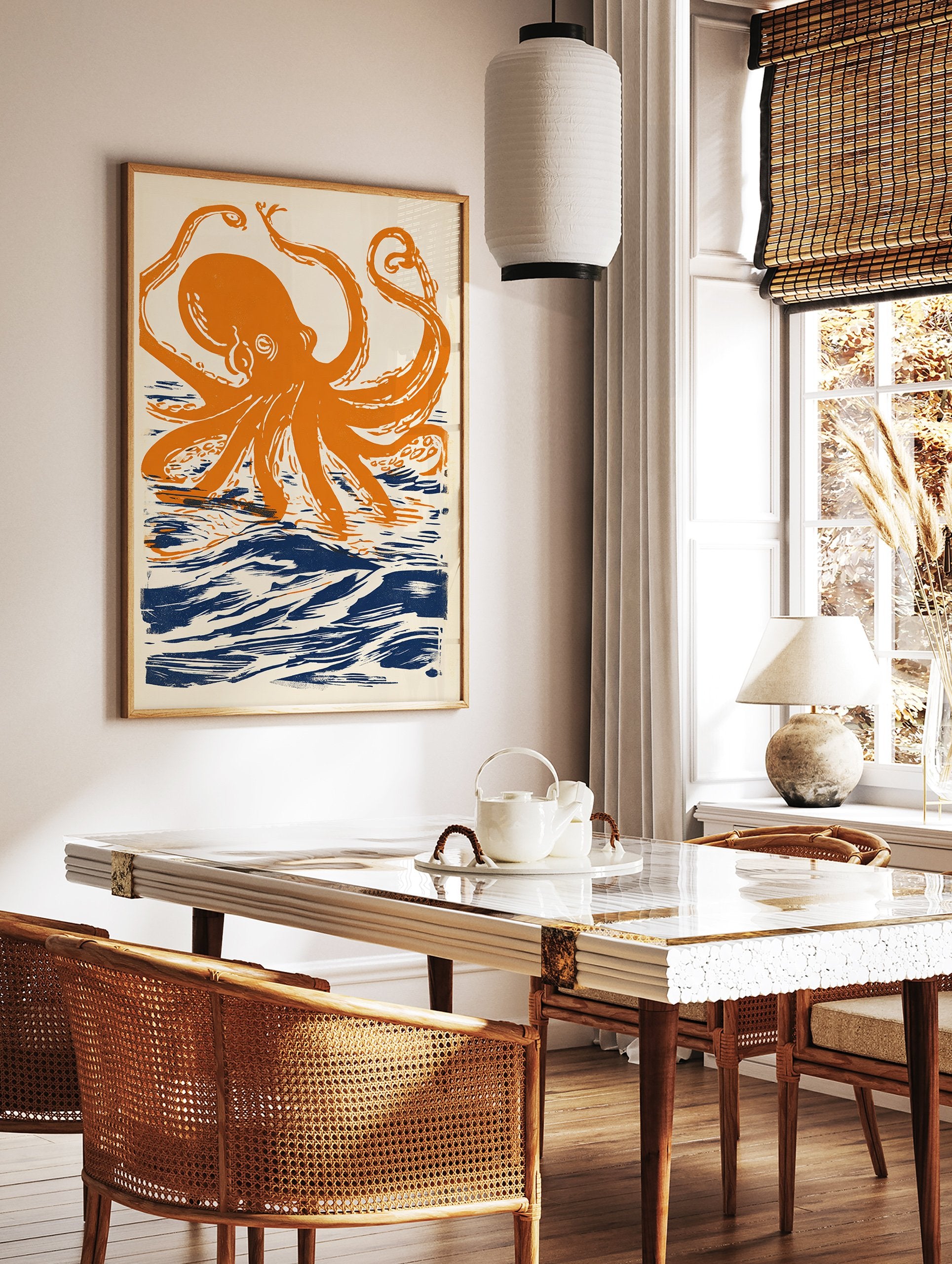 Orange octopus wall art print with dark blue ocean waves on a cream background, illustrated in a linocut style. - Image 3