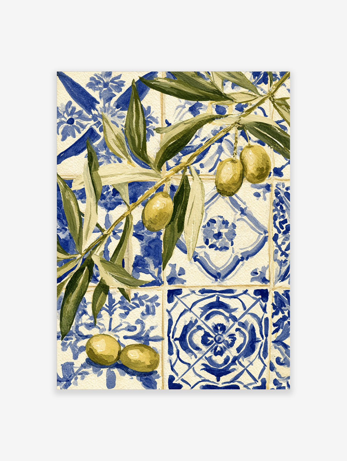 Olive branch with green leaves and yellow olives against blue and white patterned tiles