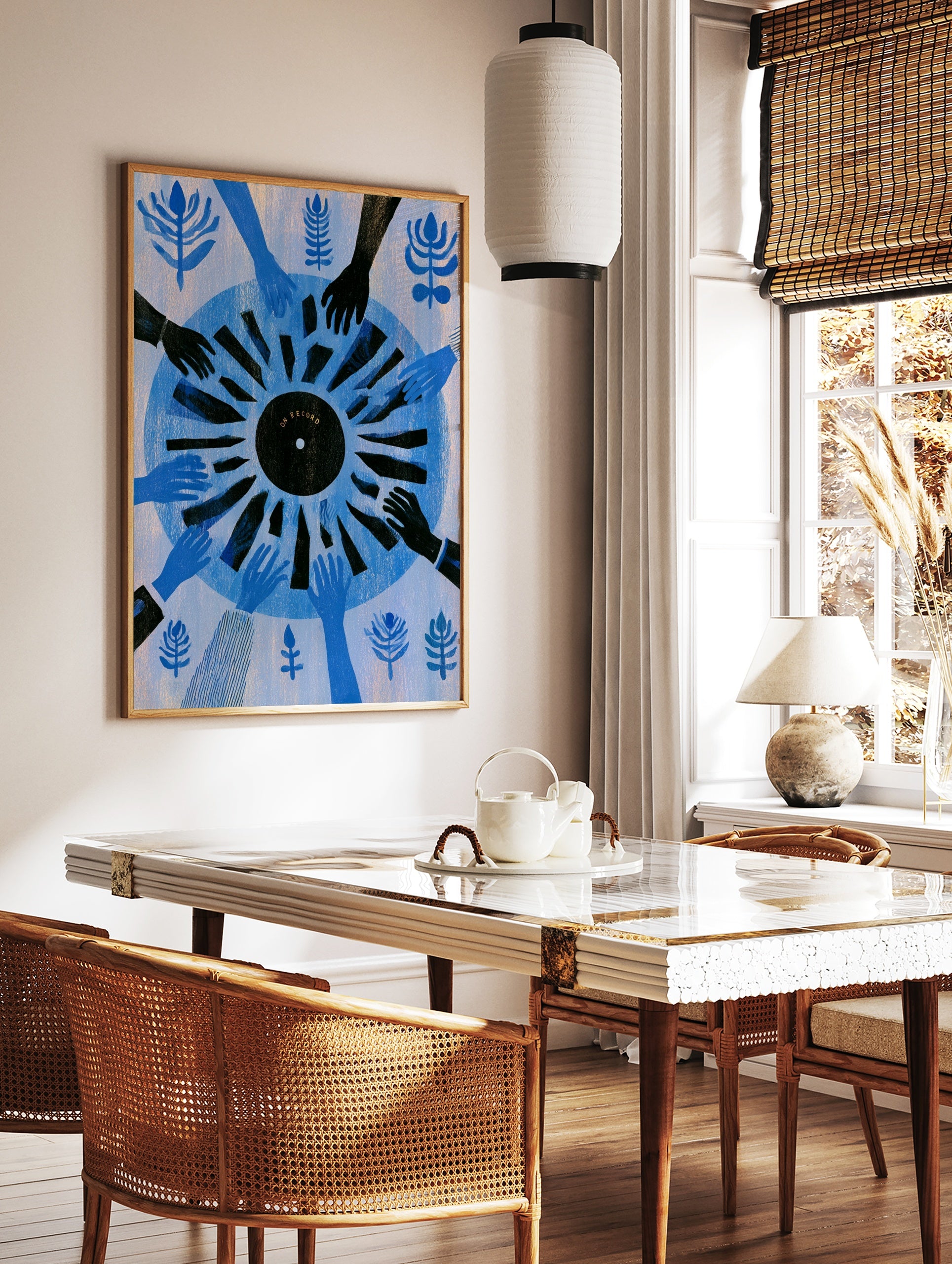 Graphic illustration of hands reaching toward a black vinyl record labelled ON RECORD on a blue, in a styled room mockup