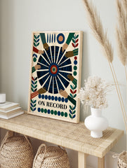 Graphic wall art print titled ON RECORD featuring a central vinyl record with reaching hands, in an alternate framed mockup