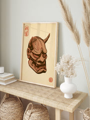 Japanese Oni mask illustration with horns, sharp teeth, and red kanji stamps on a tan, in an alternate framed mockup