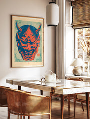 Japanese Oni mask illustration in bold red and blue colours, featuring sharp horns and bared teeth, in a styled room mockup