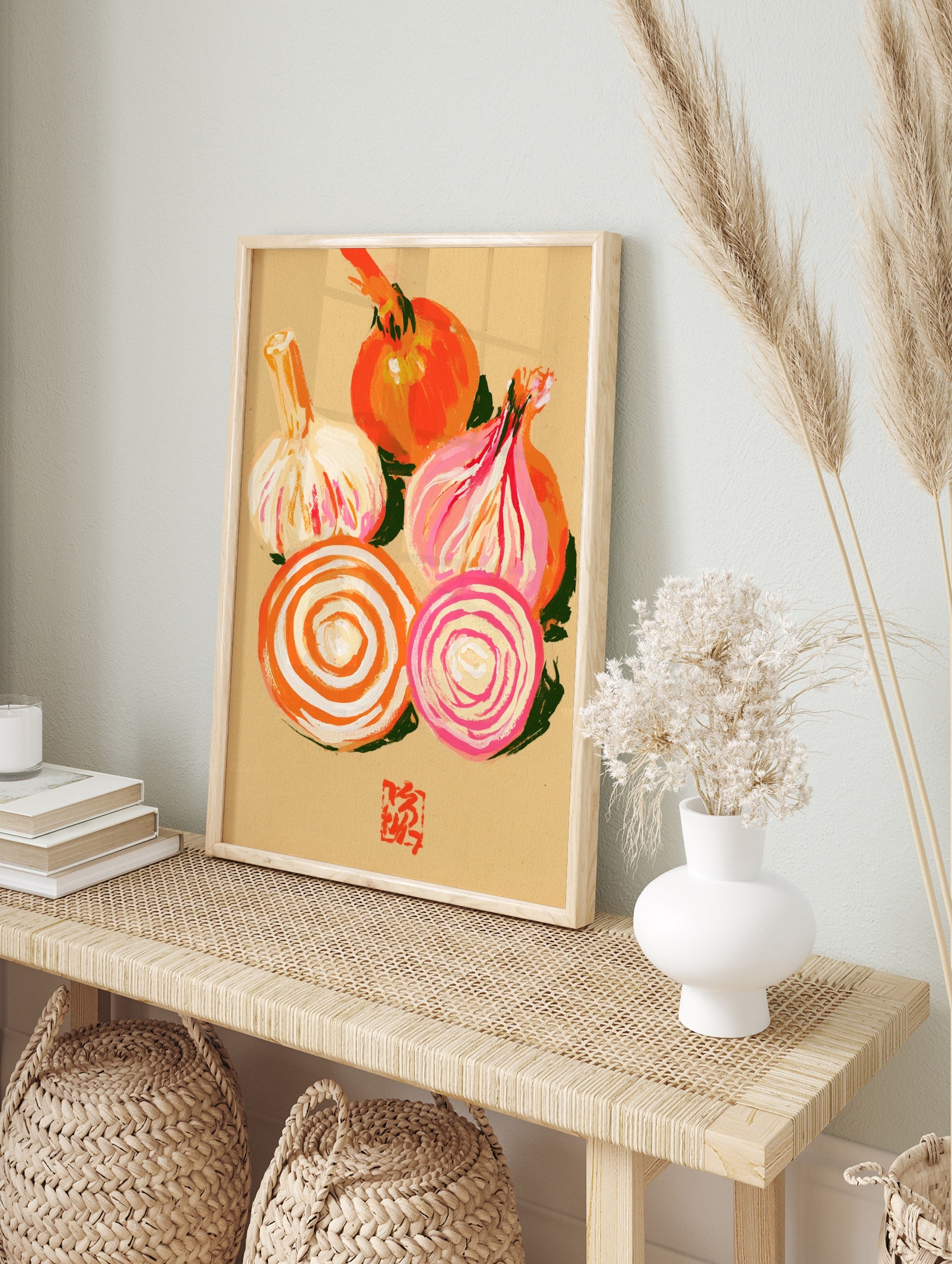 Illustrative print of a whole onion, garlic bulb, and onion slices in orange and pink tones, in an alternate framed mockup