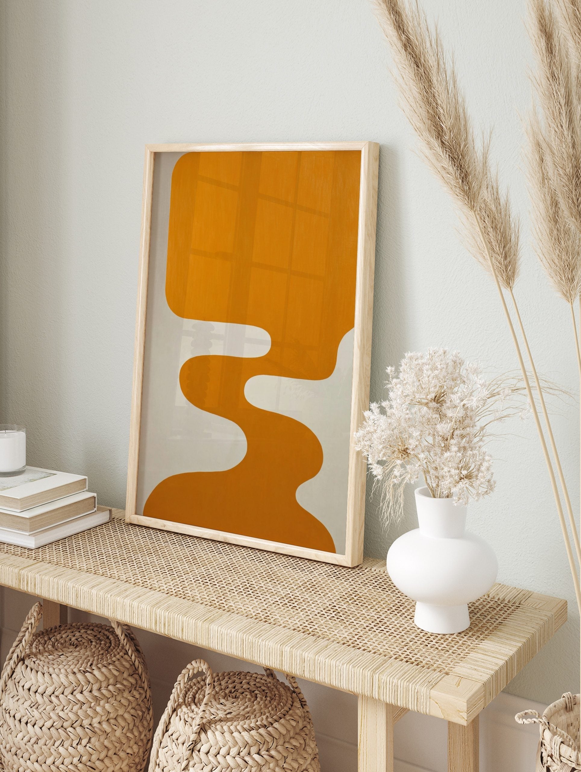 Orange abstract organic shape with fluid, wavy lines against a light grey background in a, in an alternate framed mockup