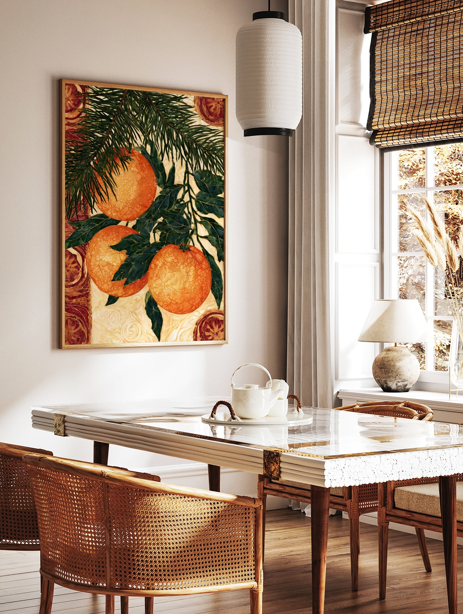 Illustrative botanical wall art of three hanging oranges on a pine branch with decorative circular, in a styled room mockup