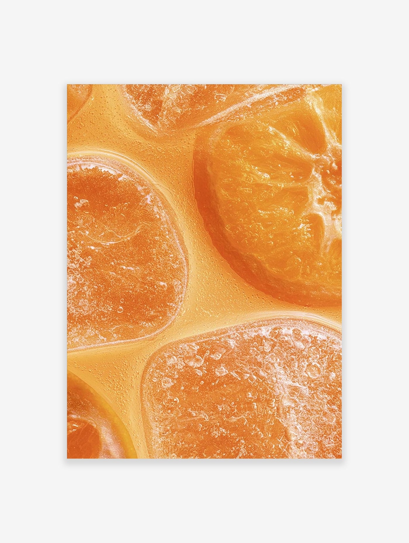 Close-up macro photograph of vibrant orange citrus fruit slices submerged in clear liquid