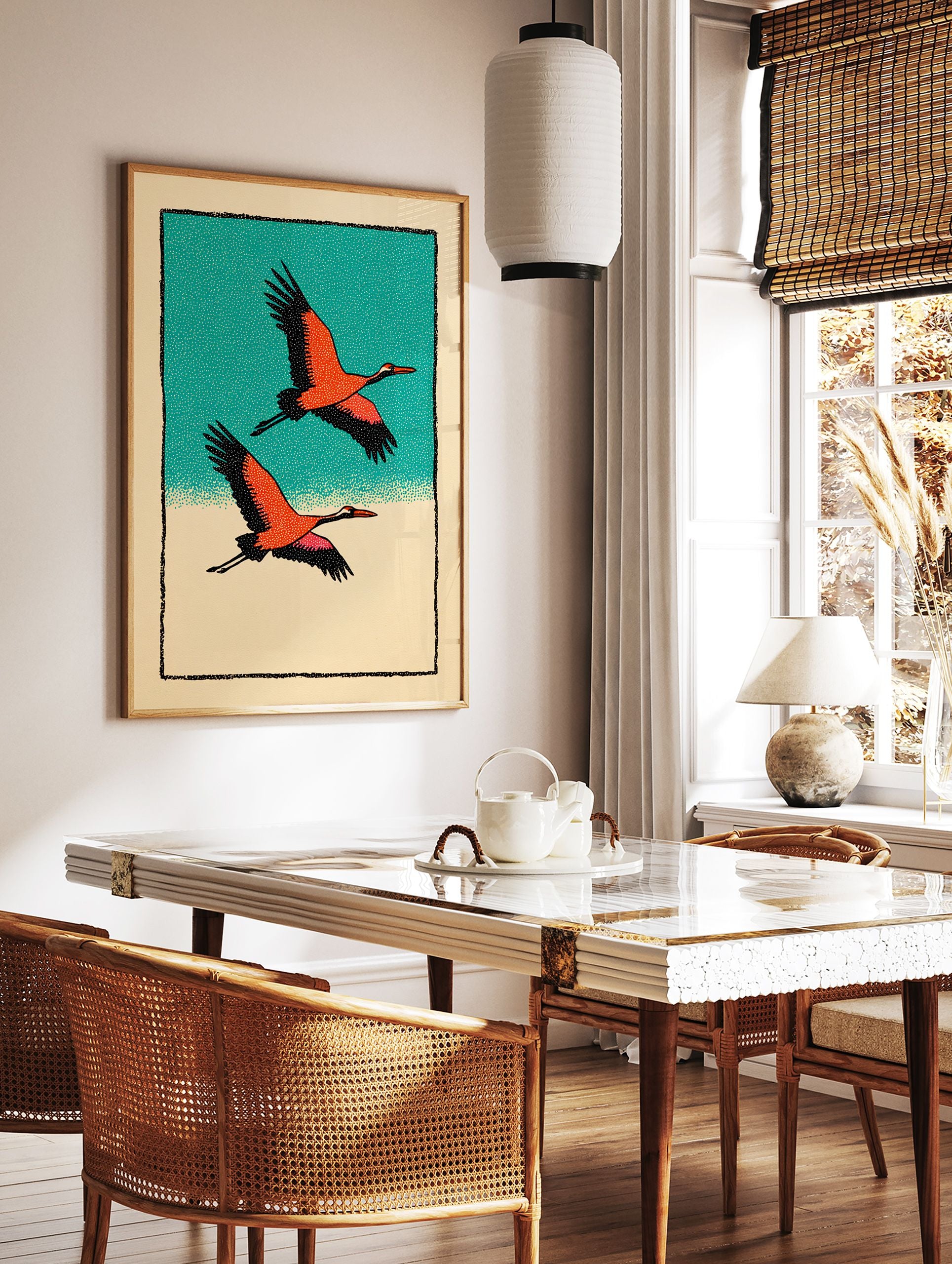 Two orange and black cranes flying against a teal sky and beige ground, in a Japanese illustrative wall art print. - Image 2