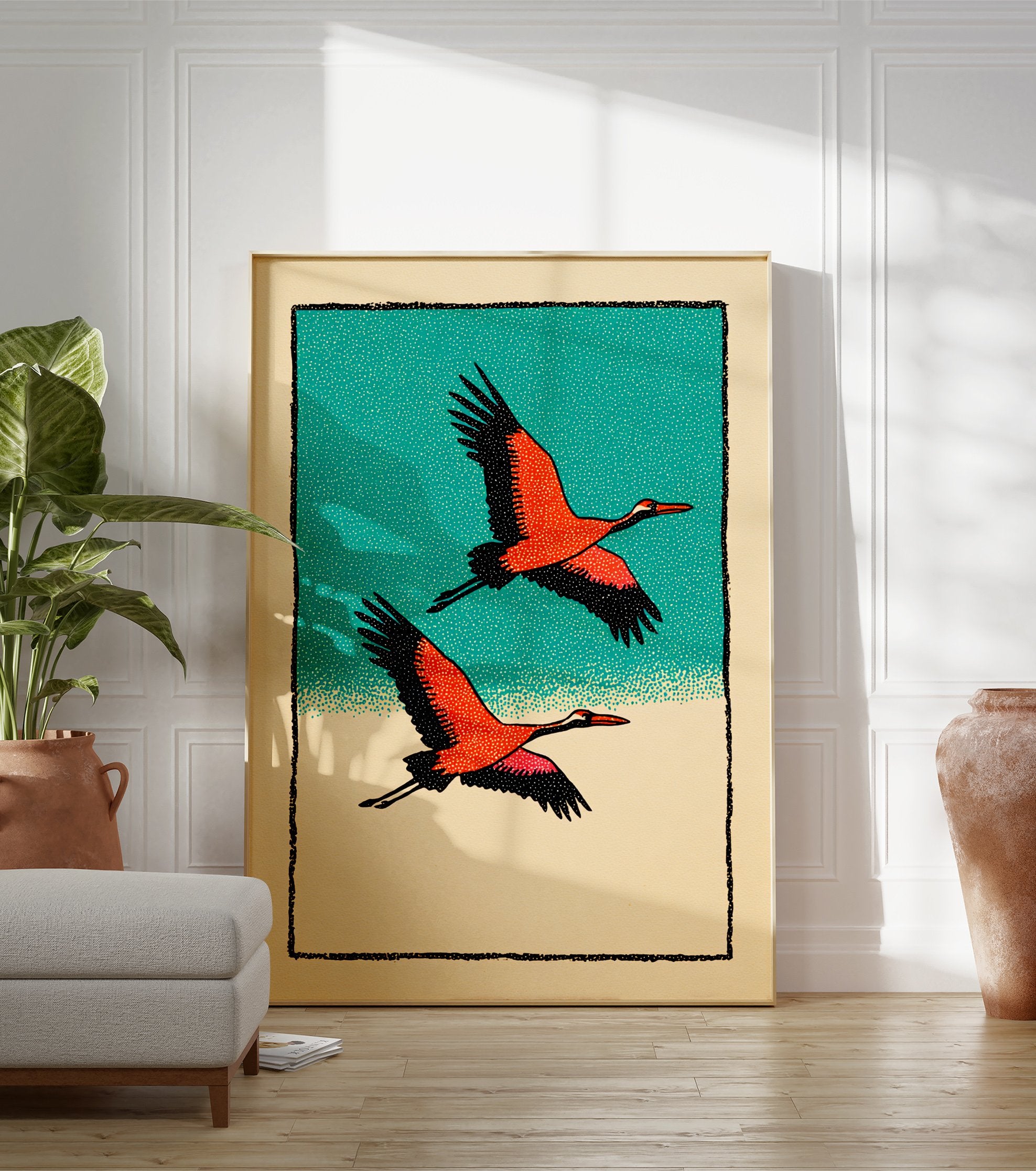 Two orange and black cranes flying against a teal sky and beige ground, in a Japanese illustrative wall art print. - Image 3