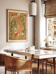 Orange koi fish illustration with white accents, swimming amidst green aquatic plants within an, in a styled room mockup
